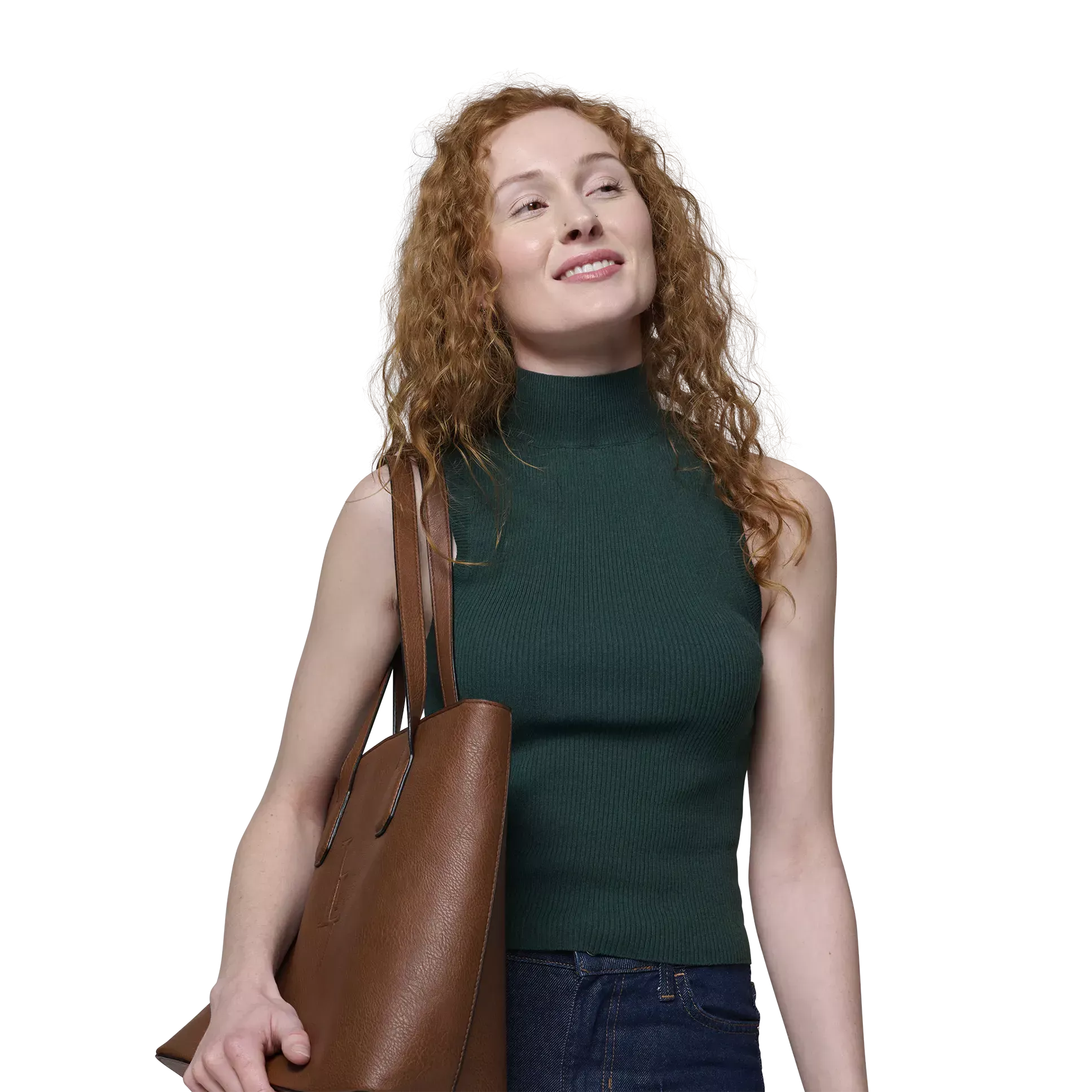 Confident young woman with long, curly red hair and a handbag