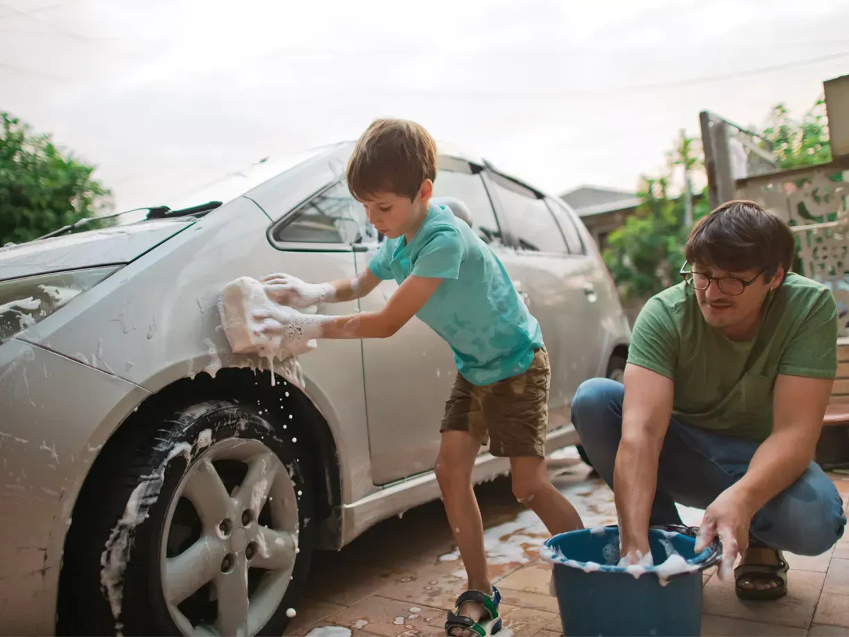 Father and son washing the car - Tower Insurance 